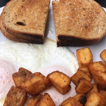 Uptown Restaurant - Top. Sausage with over easy eggs, deep fried potatoes, and rye.  Bottom. Over easy eggs, deep fried potatoes, and rye. - Breakfast & Brunch Near Me - Windsor, Ontario