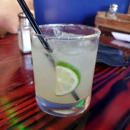 a margarita in a glass with a straw a margarita in a glass with a straw