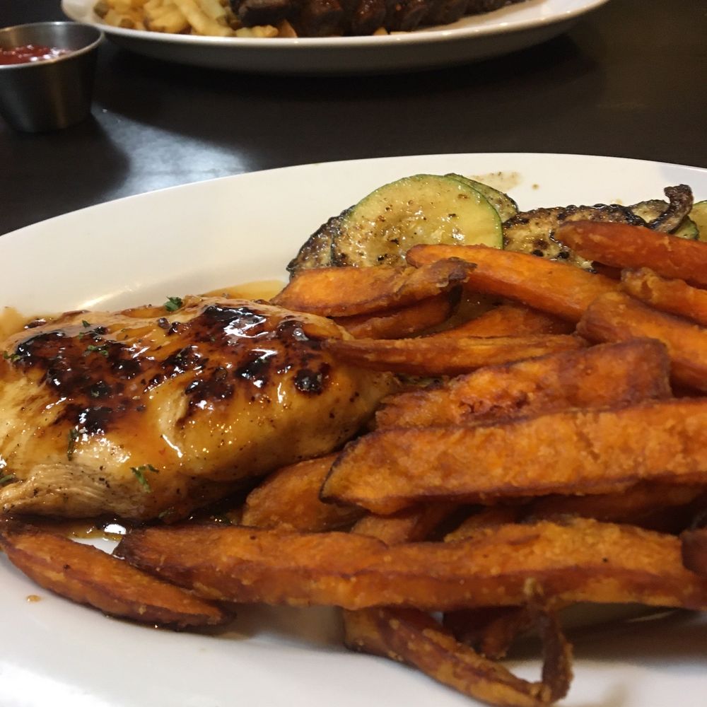 Grilled chicken, zucchini and sweet potato fries.