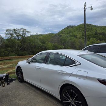 The Homeplace - My pearl white Lexus parked in their parking lot with the mountains in the background. - American Near Me - Catawba, Virginia