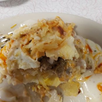 J's Prairie Rose - The Tower. Stacked with egg, sausage, hashbrowns, biscuit and gravy. Top it off with their homemade green chili - Breakfast & Brunch Near Me - Laramie, Wyoming J's Prairie Rose - The Tower. Stacked with egg, sausage, hashbrowns, biscuit and gravy. Top it off with their homemade green chili - Breakfast & Brunch Near Me - Laramie, Wyoming