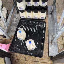 ALDI - Spilled Milk In Dairy Case.
