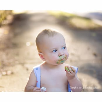 Willow Baby Studios - One year old thoughtfully enjoying his 1st birthday cake - Session Photography Near Me - Arlington, Massachusetts Willow Baby Studios - One year old thoughtfully enjoying his 1st birthday cake - Session Photography Near Me - Arlington, Massachusetts