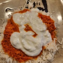 Taste Of Punjab - We split the Butter Chicken. This is how I did it putting yogurt on after reheating. Yum.