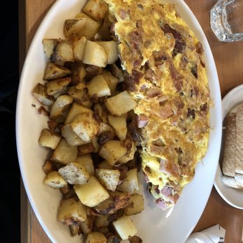 Sunset Grill - MEAT LOVERS OMELETTE - $12.99 Peameal style bacon, ham, bacon, sausage and cheddar cheese - Breakfast & Brunch Near Me - Markham, Ontario