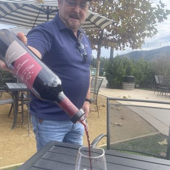Solis Winery - Staff member really kind pouring out some red wine for us to sample - Wineries Near Me - Gilroy, California Solis Winery - Staff member really kind pouring out some red wine for us to sample - Wineries Near Me - Gilroy, California