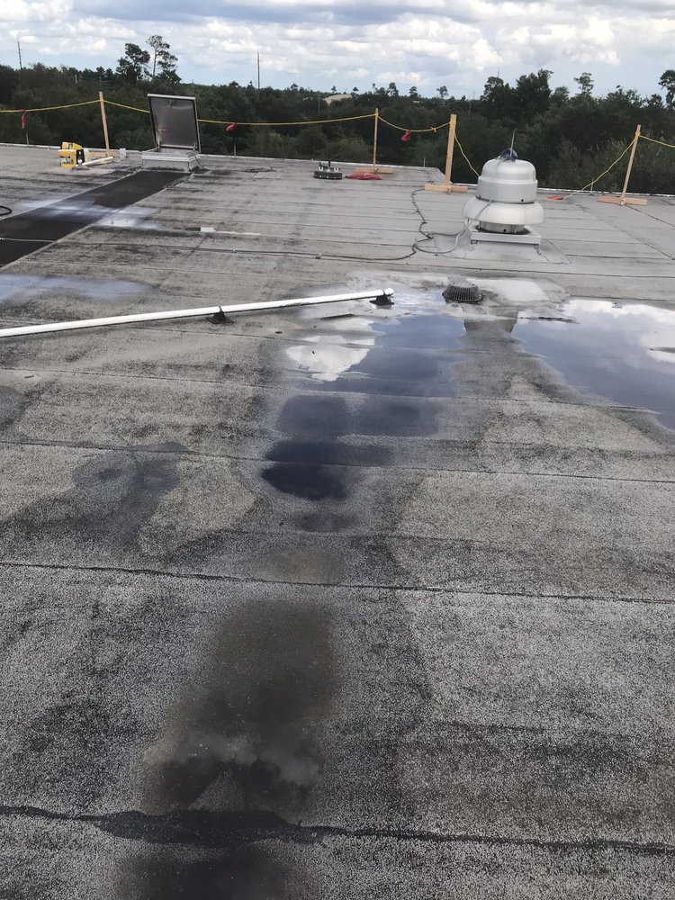 Slide of Dino Roofing Services