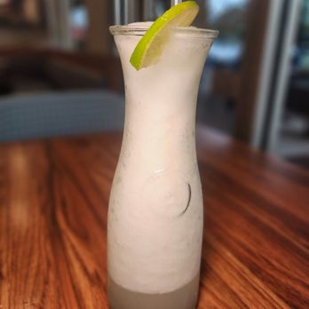 Luka Restaurant - a tall glass with a lime slice in it - Latin American Near Me - Plantation, Florida Luka Restaurant - a tall glass with a lime slice in it - Latin American Near Me - Plantation, Florida