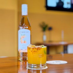 Chili Mango Margarita - jalapeño-infused libélula blanco, mango, lime, chili-chamoy syrup, tajin rim