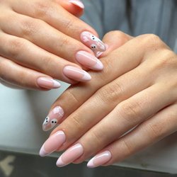 Art Glow Nails - Soft pink French manicure with delicate floral accents and an elegant almond shape. Handcrafted at Art Glow Nails in Van Nuys.