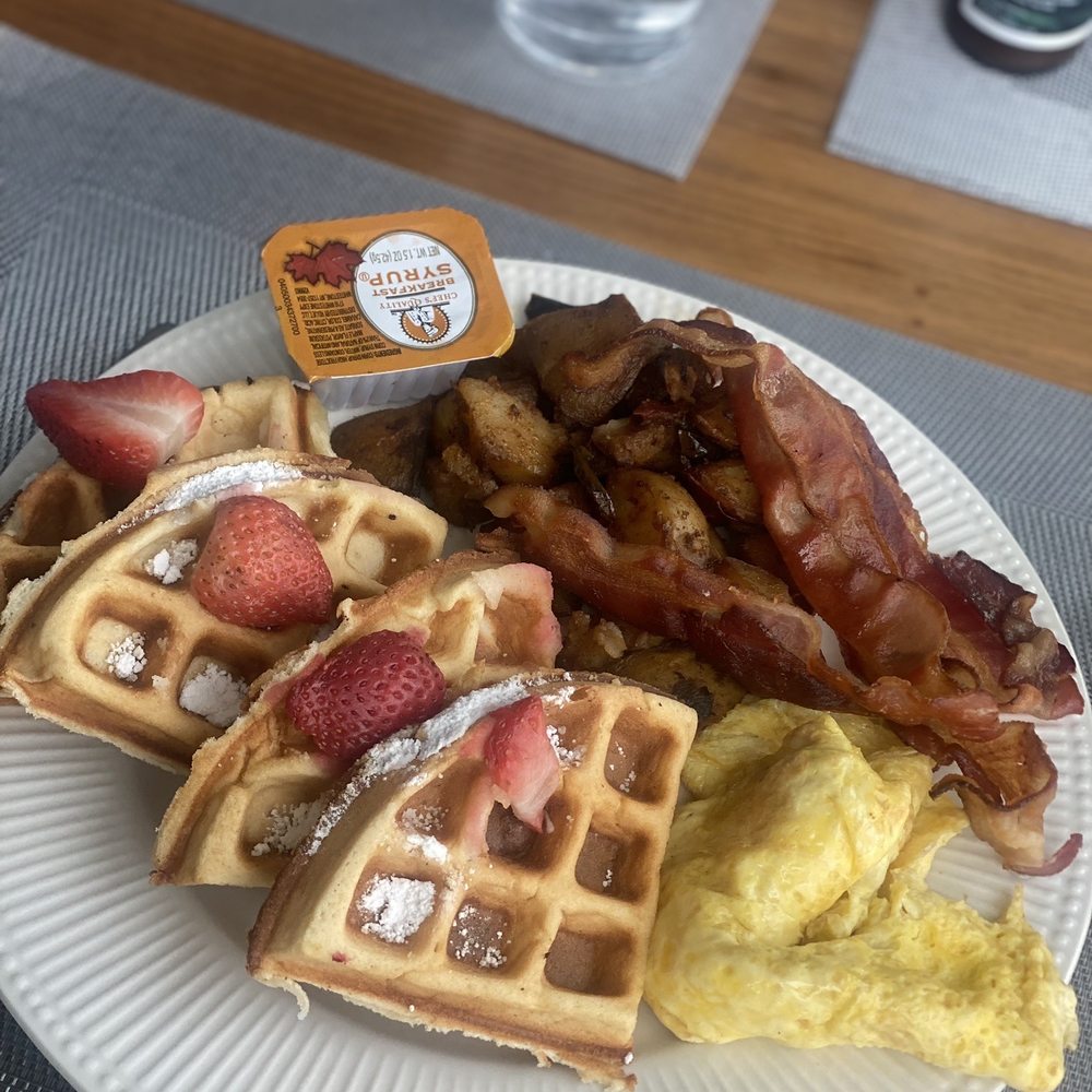 Waffles w/ bacon, eggs, and home fries