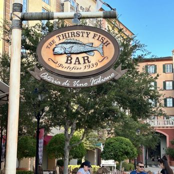 The Thirsty Fish - people sitting at tables outside - Italian Near Me - Orlando, Florida The Thirsty Fish - people sitting at tables outside - Italian Near Me - Orlando, Florida