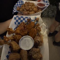 Garlic parm wings Sweet chili wings Garlic parm tots in the back Garlic parm wings Sweet chili wings Garlic parm tots in the back