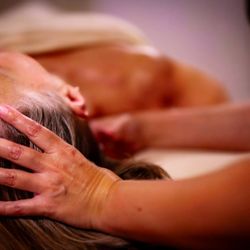 Jessica Oliveira Massage Therapy - Jessica Oliveira LMT giving a client a neck massage