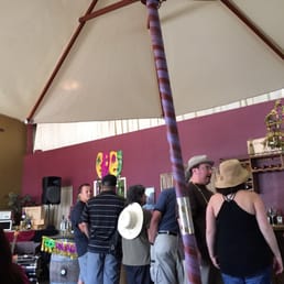 a group of people standing under an umbrella