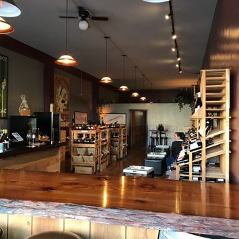 Libation - a view of a bar with stools - Beer, Wine & Spirits Near Me - Arcata, California