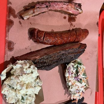 Terry Black's Barbecue - The Pick Chris - Brisket, sausage, Pork ribs, tater salad, and slaw. - Barbeque Near Me - Austin, Texas Terry Black's Barbecue - The Pick Chris - Brisket, sausage, Pork ribs, tater salad, and slaw. - Barbeque Near Me - Austin, Texas
