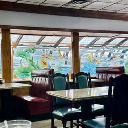 Golden Gate Chinese Restaurant - The authentic Chinese restaurant with burgundy color booth and lilies pond pictures glass windows decor.