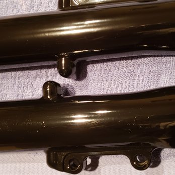 ProTec Powder Coating - Trash and sand in the finished coating on the bottom tube. - Powder Coating Near Me - Jacksonville, Florida