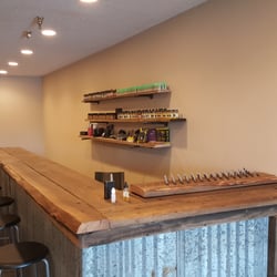 Erupted Vapor - 100 year old lumber, hand made Vape bar? Yeah. We got that.
