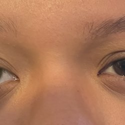 Creative Eyebrow Threading Salon - Grew my eyebrows for two months and told her not too thin keep it thick and leave them EVEN. Left the front very different from both of them