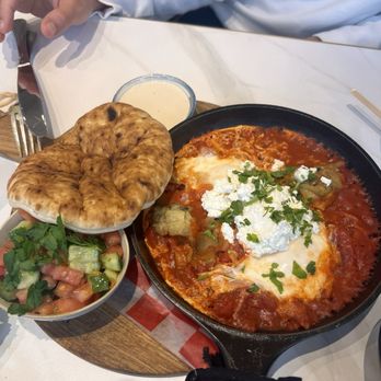 Cafe Landwer - Mediterranean shakshouka comes with two over easy eggs eggplant & feta cheese on top. - Breakfast & Brunch Near Me - Hallandale Beach, Florida
