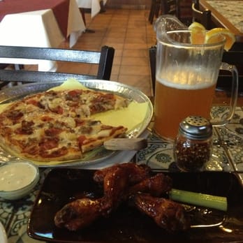 Corner Joint - The usual: meat lovers with either jalapeños or pineapple, wings, and a pitcher! Yum! - Pizza Near Me - Lawndale, California