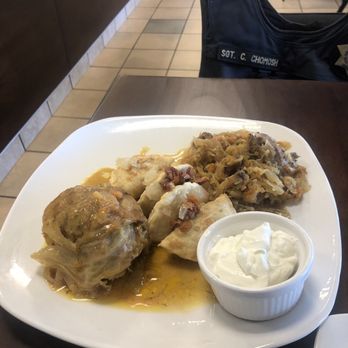 Taste of Poland - Polish plate. Stuffed cabbage left, perogies middle, hunters stew on right. - Polish Near Me - Tulsa, Oklahoma Taste of Poland - Polish plate. Stuffed cabbage left, perogies middle, hunters stew on right. - Polish Near Me - Tulsa, Oklahoma