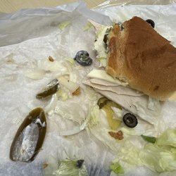 Fountain Sub And Salads - Jalapeños and toppings over flowing