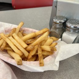 Single order of fries. Salt and pepper shakers for scale. Single order of fries. Salt and pepper shakers for scale.