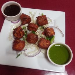 Paneer Pakora Appetizer With Tamarind And Green Chutney. (~$9) Paneer Pakora Appetizer With Tamarind And Green Chutney. (~$9)