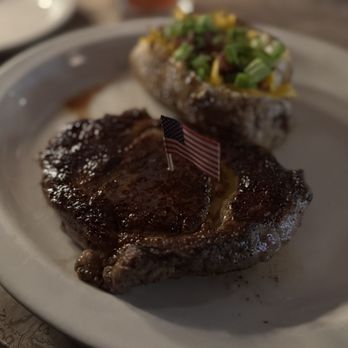 Ted's Montana Grill - Bison Delmonico Ribeye (14 Oz) was amazing.   Dont let the dark pic mislead you - Steakhouses Near Me - Alexandria, Virginia