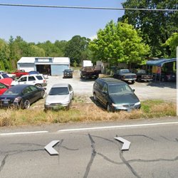 Country Auto - Parking lot of Country auto the only place to go to have your car repaired