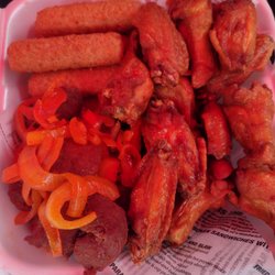D'Campo Sport Bar and Grill - Deep fried goodness - chicken wings, pickled onions over deep fried pork, mozzarella sticks.