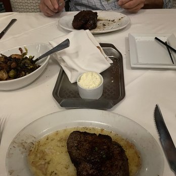 Ruth's Chris Steak House - My much smaller filet than his, and he had already eaten much of his - Steakhouses Near Me - South Barrington, Illinois