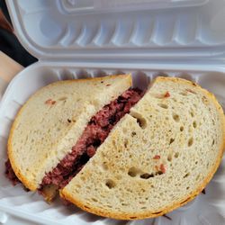Manny's Deli Stop - Cornbeef sandwich on rye bread and Cooper sharp cheese