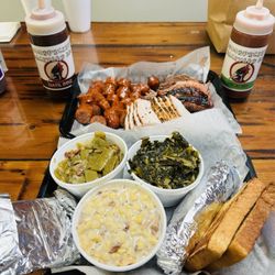 Woodpeckers Backyard BBQ - 3 meat combo (brisket, sausage, and turkey) with beans, collard greens, and cream corn.