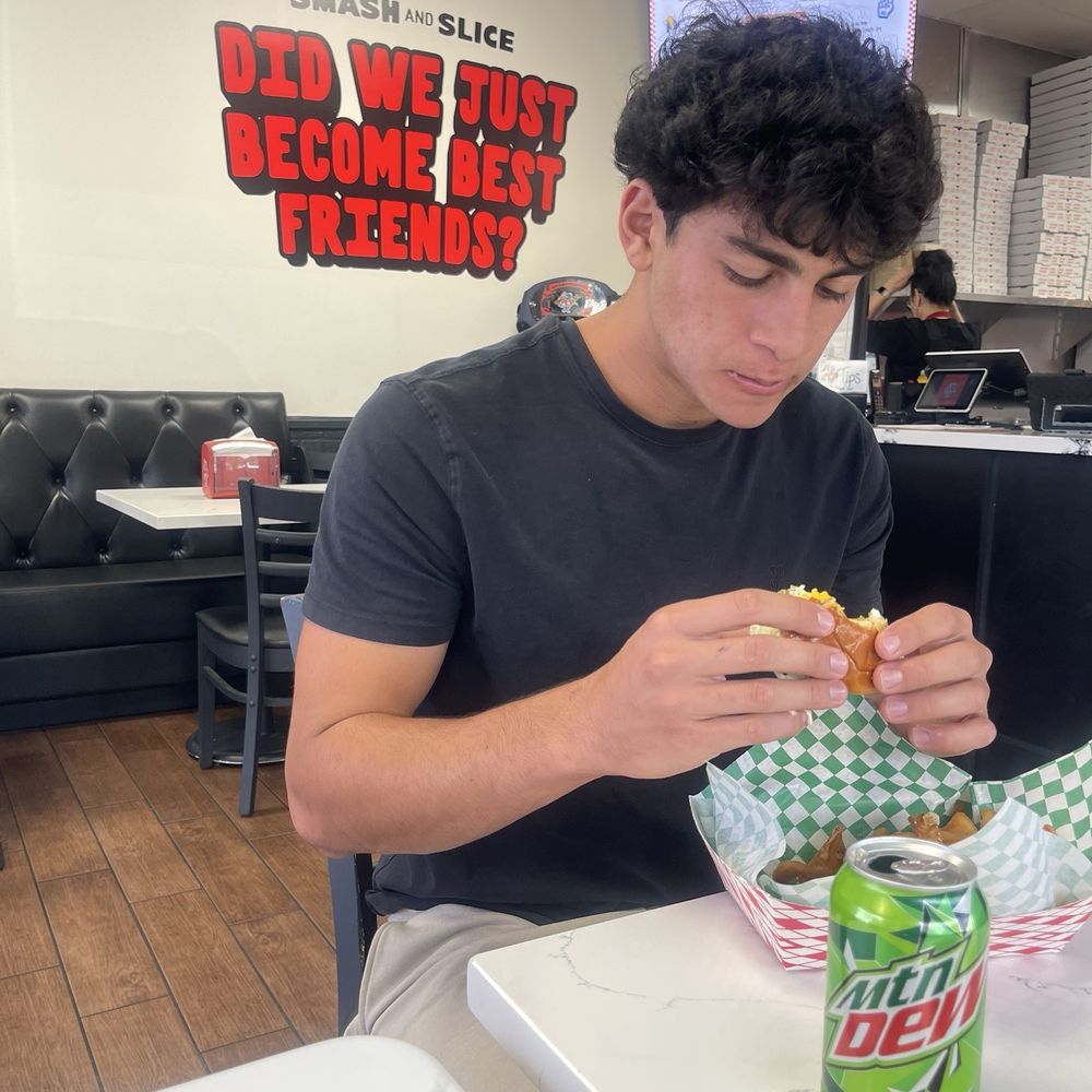 Smash And Slice - My son is enjoying his Double Smash burger very much! - Pizza Near Me - Las Vegas, Nevada Smash And Slice - My son is enjoying his Double Smash burger very much! - Pizza Near Me - Las Vegas, Nevada