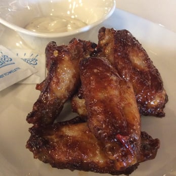 Stella's Place - a plate of chicken wings and a bowl of sauce - Cafes Near Me - Fox Lake, Illinois Stella's Place - a plate of chicken wings and a bowl of sauce - Cafes Near Me - Fox Lake, Illinois