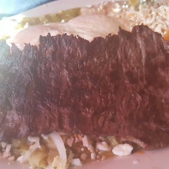 Manjares Restaurant - Chilaquiles verdes con cecina. Los platillos vienen con arroz y frijoles. - New American Near Me - Chicago, Illinois