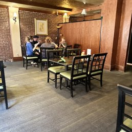people sitting at tables in a restaurant people sitting at tables in a restaurant