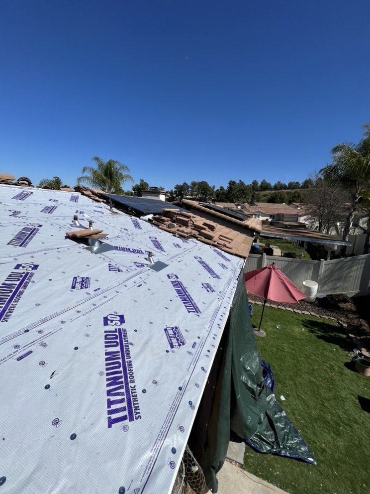 Slide of Courtesy Roofing Services