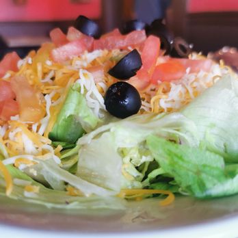 Garcia's - a salad with lettuce, tomatoes, black olives and cheese - Mexican Near Me - Phoenix, Arizona