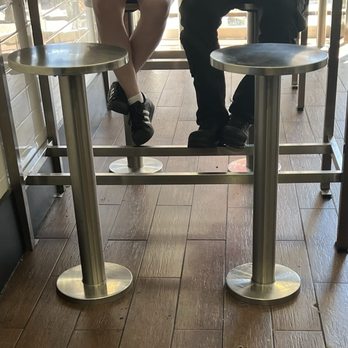 7th Street Burger Upper East Side - Two tables with seven stools total. Plus another table, standing only. - Burgers Near Me - New York, New York