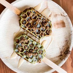 The Maple Reserve - Matcha gluten free waffle with white chocolate, fresh mango, & house made maple sesame brittle.