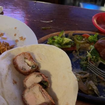 Fausto's Fiesta Cafe - a hand holding a tortilla - Cafes Near Me - Deridder, Louisiana