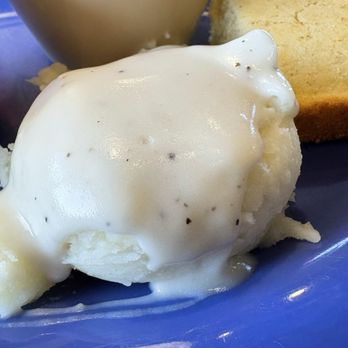 Gina's Place - tiny portion of mashed potatoes topped with white gravy - Breakfast & Brunch Near Me - Jonesboro, Arkansas