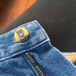 Had to use my own button, 2nd pair with a button replacement.