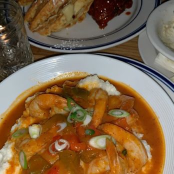 Sweet Chick - Front: Shrimp & Grits (Disappointing, just tastes like bell pepper). Back: Maple Chipotle Chicken & candied yam waffle (delicious). - Southern Near Me - New York, New York