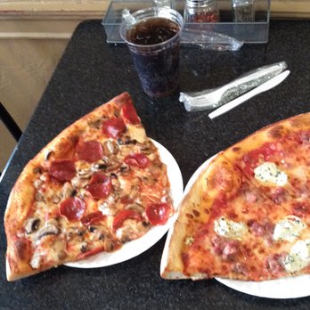 Ernesto's - Here's an aerial view of my 2 slices of pizza and a soft drink at a small table inside. - Pizza Near Me - Boston, Massachusetts Ernesto's - Here's an aerial view of my 2 slices of pizza and a soft drink at a small table inside. - Pizza Near Me - Boston, Massachusetts